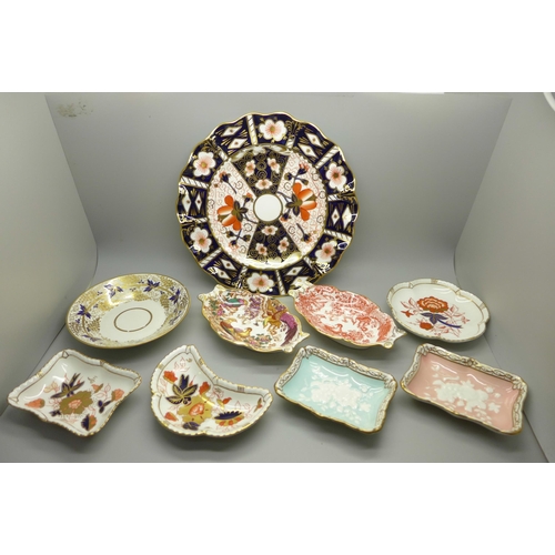 610 - A collection of Royal Crown Derby; seven trinket dishes, a saucer and a 2451 wavy edge side plate