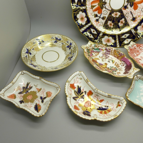 610 - A collection of Royal Crown Derby; seven trinket dishes, a saucer and a 2451 wavy edge side plate