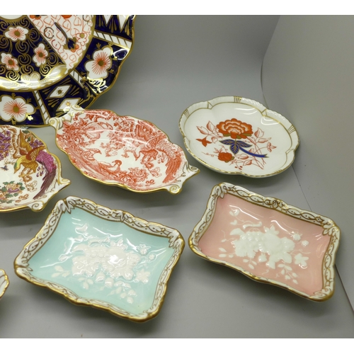 610 - A collection of Royal Crown Derby; seven trinket dishes, a saucer and a 2451 wavy edge side plate