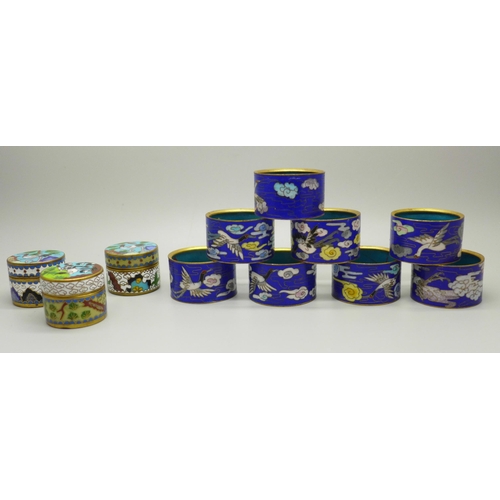 612 - Three cloisonne pill boxes and a set of eight napkin rings