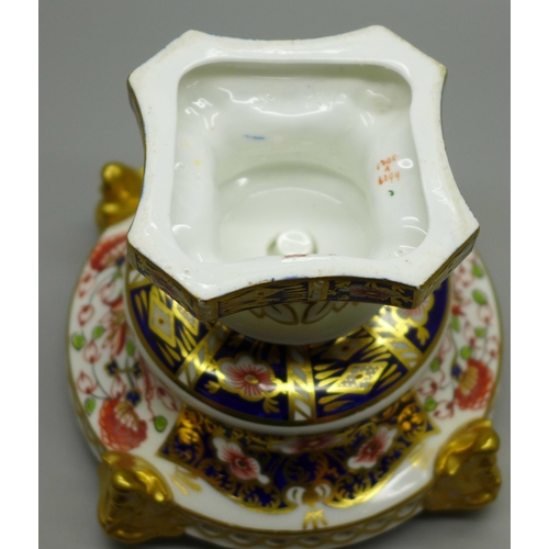 614 - A Royal Crown Derby Imari pot pourri footed bowl on lions paw feet, with classical faces, 93mm