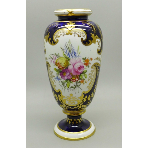 624 - A small Royal Crown Derby vase, cobalt blue ground with gilding and two panels of a bouquet of flowe... 