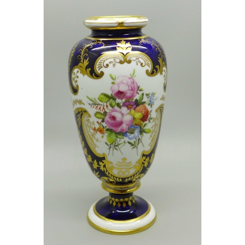 624 - A small Royal Crown Derby vase, cobalt blue ground with gilding and two panels of a bouquet of flowe... 