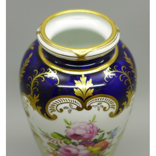 624 - A small Royal Crown Derby vase, cobalt blue ground with gilding and two panels of a bouquet of flowe... 