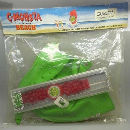 635 - A Swatch Scuba 200 C-Monsta wristwatch, boxed and swimming cap, in original packaging