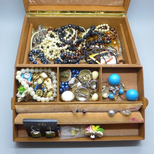 638 - A jewellery box containing costume jewellery and wristwatches