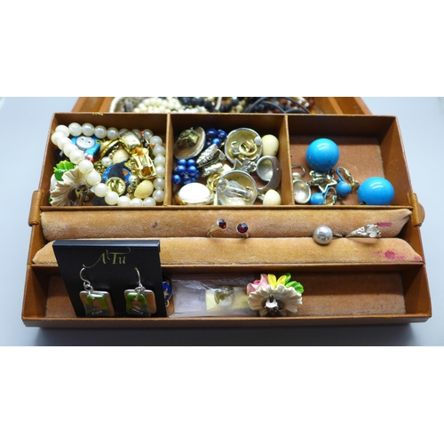 638 - A jewellery box containing costume jewellery and wristwatches