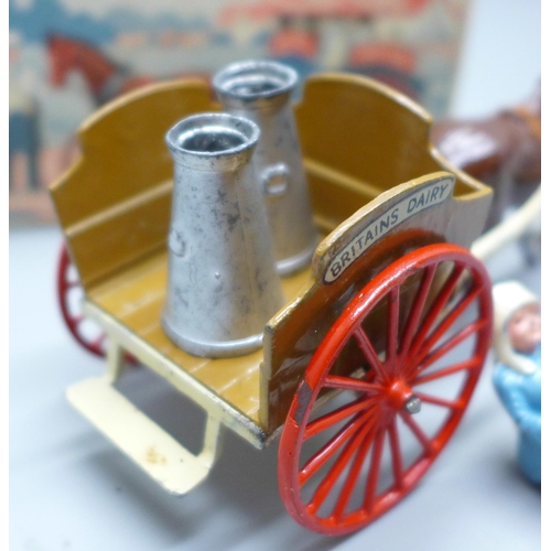 648 - A W Britain horse-drawn milk float with milkman and two churns, milkman a/f, boxed