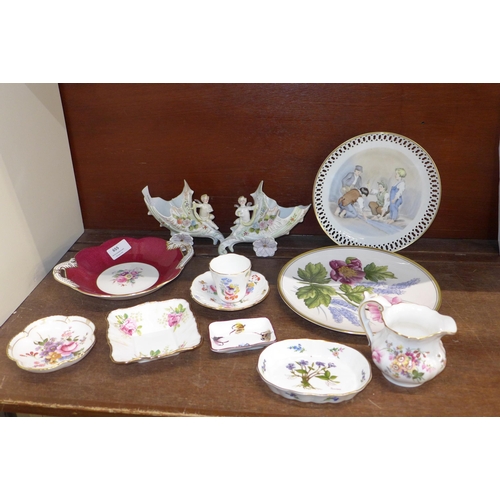 655 - A pair of Victorian spill holders, one repaired, a Minton cup and saucer, a Derby Posies cream jug, ... 