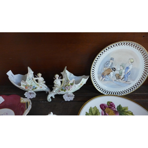 655 - A pair of Victorian spill holders, one repaired, a Minton cup and saucer, a Derby Posies cream jug, ... 