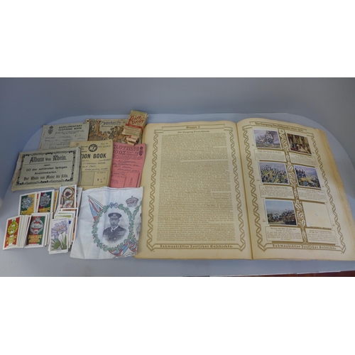 657 - A German photo-sticker album, a collection of cigarette cards, a Silver Jubilee commemorative handke... 