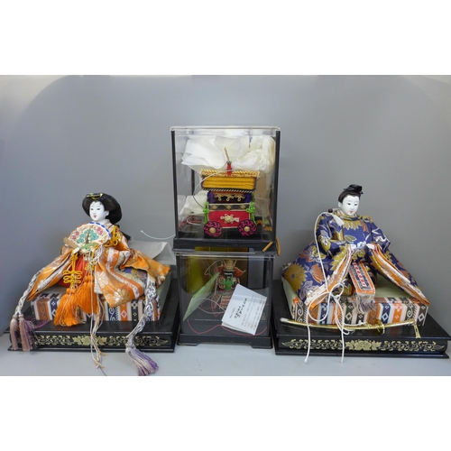 677 - Three Japanese figures; two Geisha, a Samurai plus a ceremonial wagon