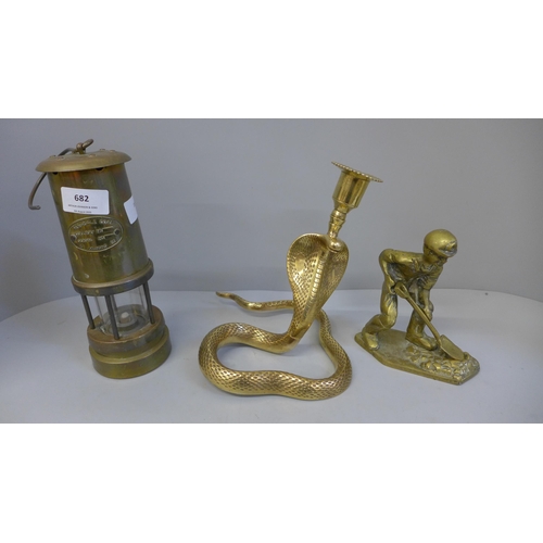 682 - A Ferndale Coal Mining Co. miners lamp, a brass model of a miner and a brass cobra candlestick