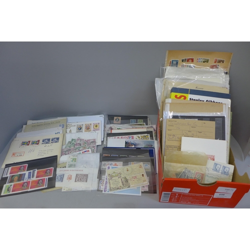 698 - Stamps; a box of stamps, covers, etc.