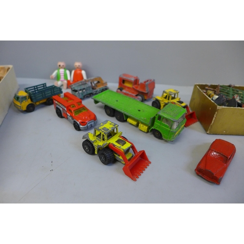 702 - A collection of Matchbox and other vehicles, playworn and a collection of lead farm animals and figu... 