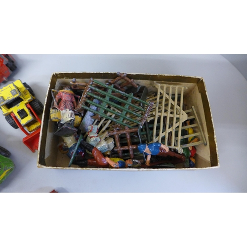 702 - A collection of Matchbox and other vehicles, playworn and a collection of lead farm animals and figu... 