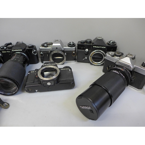 743 - A collection of nine cameras and camera bodies including Nikon 601 and Praktica