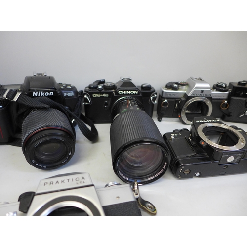 743 - A collection of nine cameras and camera bodies including Nikon 601 and Praktica