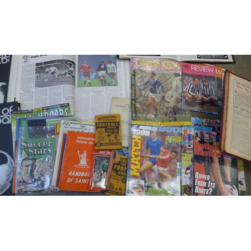 745 - Football memorabilia; a box of football ephemera including bound issues of Raich Carters Soccer Star... 