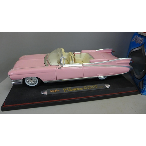 785 - Four 1/18th scale model vehicles, Maisto Hummer SUV, Signature 1941 Plymouth, Maisto Pink Cadillac E... 