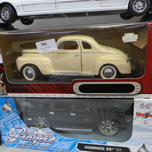 785 - Four 1/18th scale model vehicles, Maisto Hummer SUV, Signature 1941 Plymouth, Maisto Pink Cadillac E... 