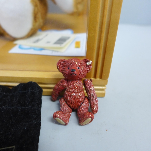 793 - A Steiff Cosy Friends bear in display box and a miniature metal bear