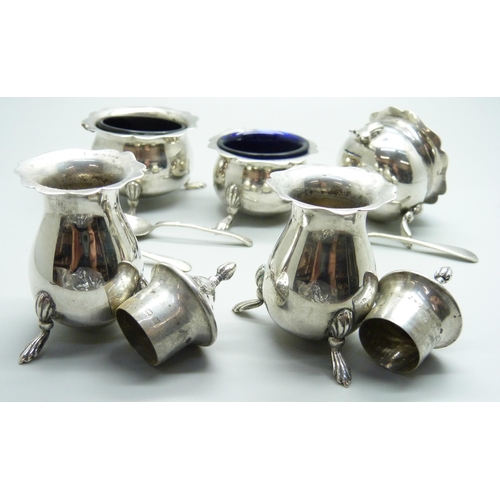 845 - A five piece silver condiment set, Birmingham 1921, 158g, and three spoons