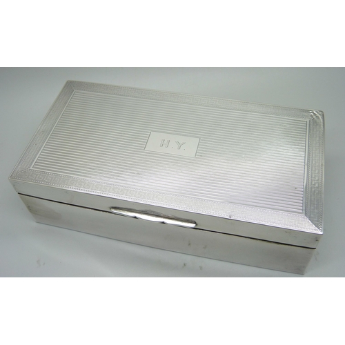 852 - A silver cigarette box, bears initials, Birmingham 1927, 17.5cm