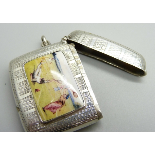 866 - A silver vesta case with applied plaque with tennis scene, engine turned case, Birmingham 1906, 35g