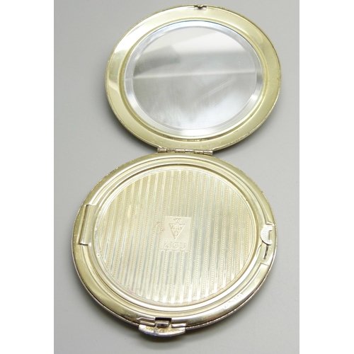 872 - A silver Kigu compact with applied plaque, engine turned case, 132g