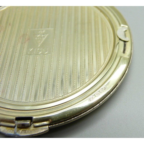 872 - A silver Kigu compact with applied plaque, engine turned case, 132g