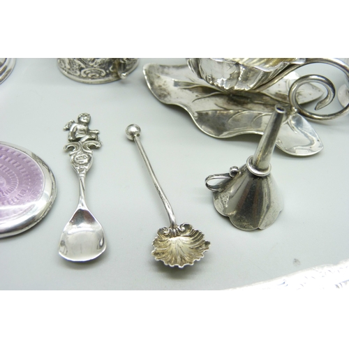 876 - Silver items comprising a small oil lamp, a small enamelled mirror, napkin ring, salt spoons, caddy ... 