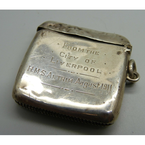 881 - An enamelled silver vesta case, with inscription, 'From the City of Liverpool H.M.S. Antrim, August ... 