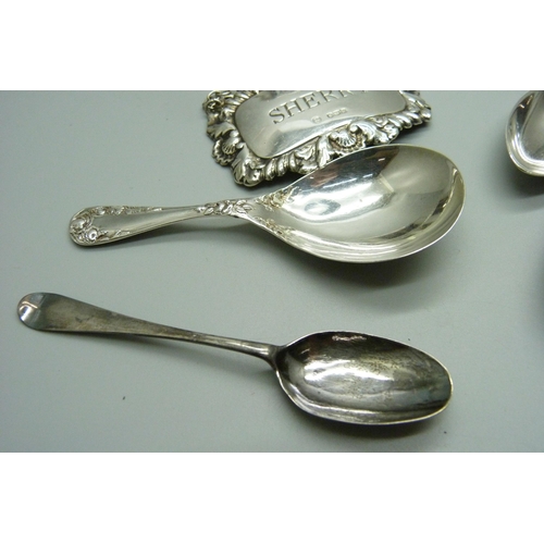 888 - Silver including a Victorian spoon, a caddy spoon and three napkin rings, 135g