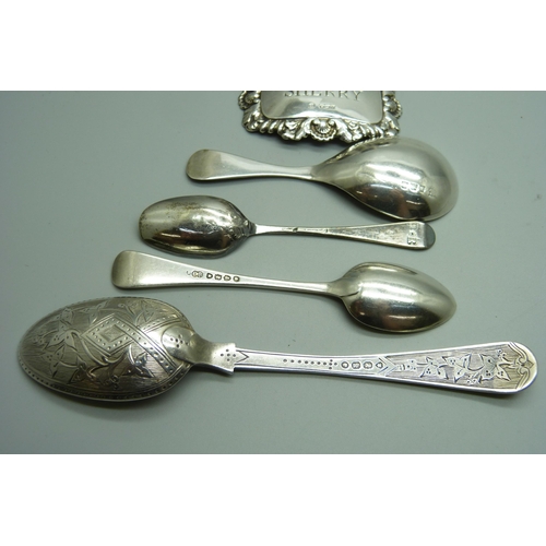 888 - Silver including a Victorian spoon, a caddy spoon and three napkin rings, 135g