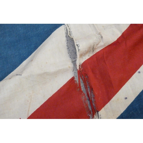 941 - A Union Jack flag, military and other badges including one mounted