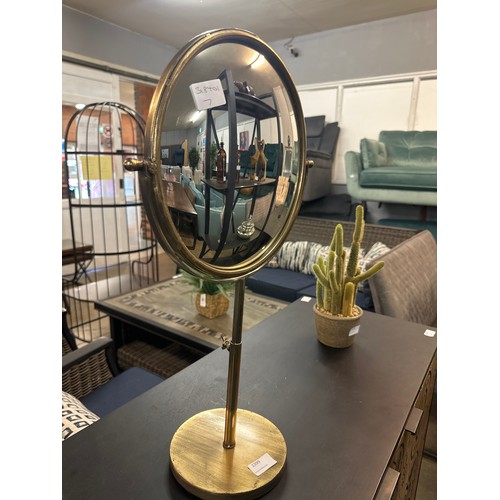 1399 - A gold shaving style mirror