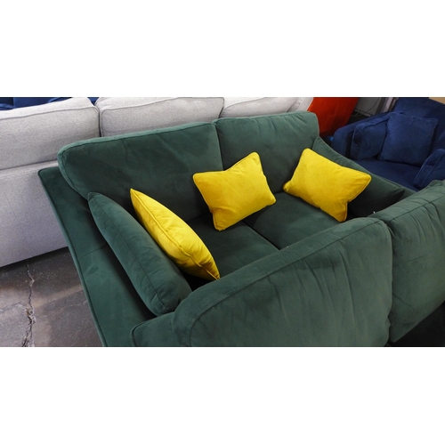 1506 - A green velvet pair of two seater sofas and armchair