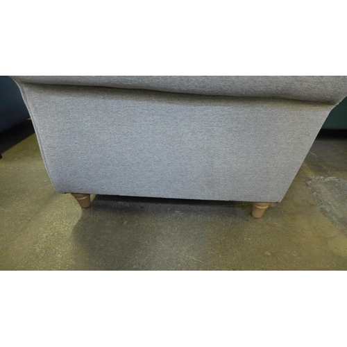 1555 - A mid grey upholstered corner sofa