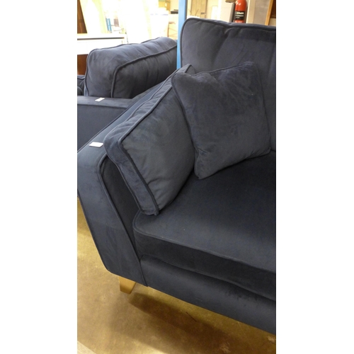 1557 - A Barker & Stonehouse navy velvet three seater sofa