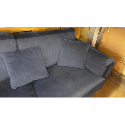 1557 - A Barker & Stonehouse navy velvet three seater sofa