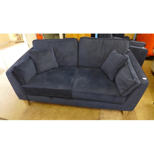 1558 - A Barker & Stonehouse navy velvet small three seater sofa