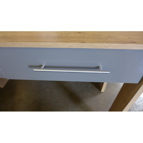 1565 - A wood effect desk/dressing table with grey drawers