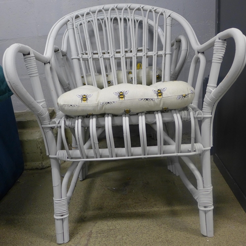 1639 - A pair of white painted chairs with Bee design seat cushions