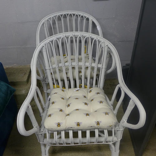 1639 - A pair of white painted chairs with Bee design seat cushions