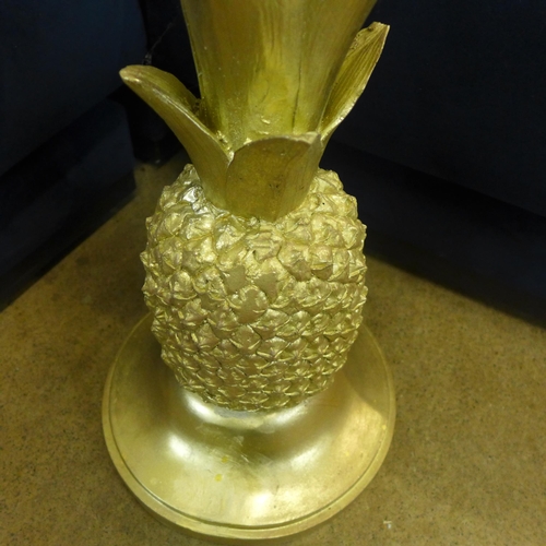 1312 - A gold pineapple occasional table with glass top