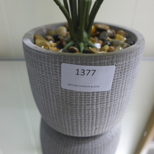 1377 - A large tropical ornamental green plant in a cement pot - H57 cms (63084407)