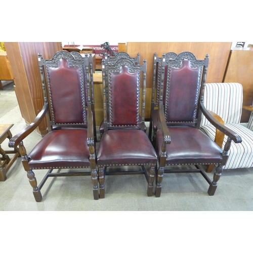 145 - A set of six Jaycee carved oak and burgundy leather dining chairs