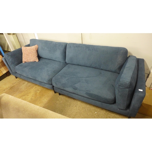 1440 - A navy blue velvet 4.5 seater sofa with black oak feet