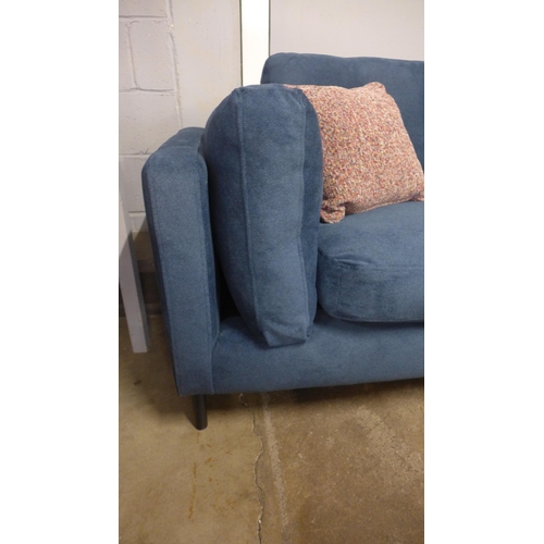 1440 - A navy blue velvet 4.5 seater sofa with black oak feet